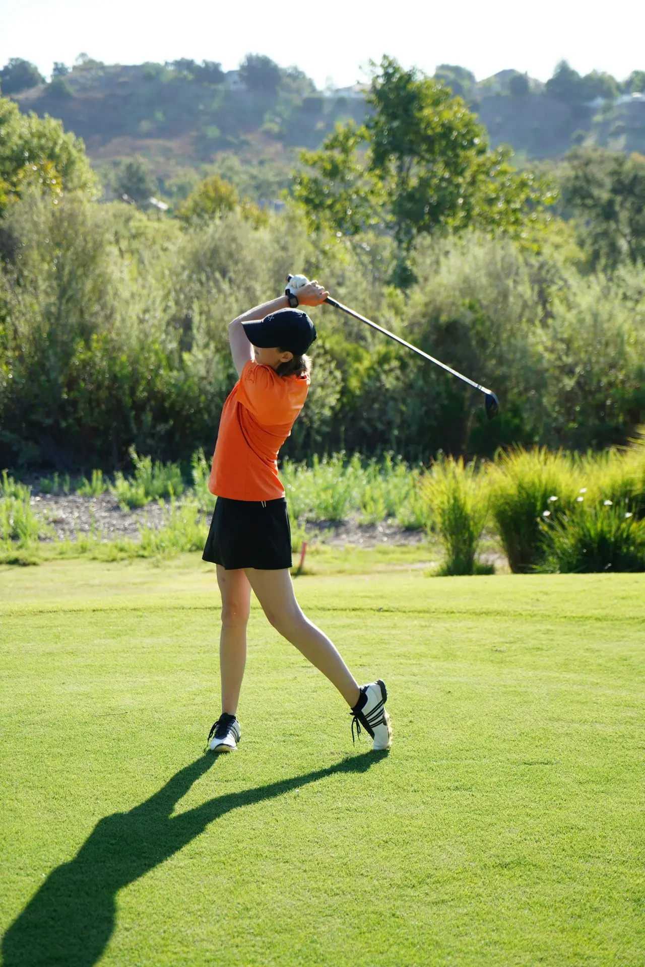 woman playing golf
